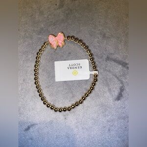 BNWT Kendra Scott Gold Stretch Bracelet with Pink Bow Charm $70